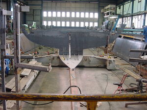 Large hull of a ship being constructed in a shipyard. | © Schmittenhöhebahn AG