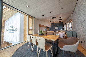 Interior view of Sonnkogel Restaurant with modern decor. | © Nikolaus Faistauer Photography